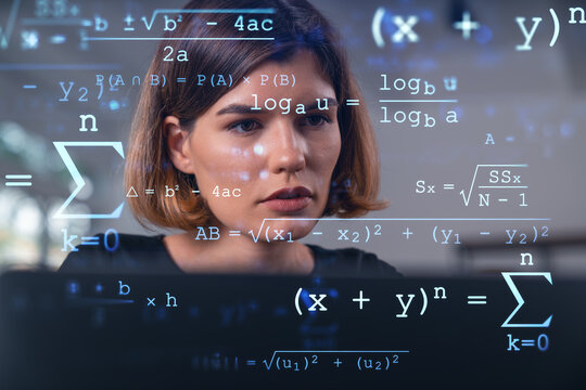 Woman analyzing mathematical formulas on a transparent screen.
