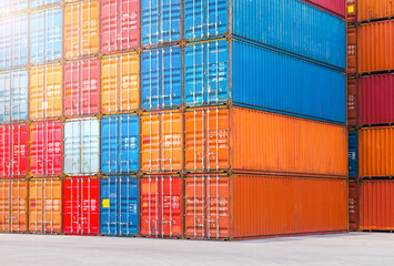 Fototapeta premium Stacked of Multicolored Containers Shipping. Handling of Logistic Transportation Industry. Cargo Container ships, Freight Trucks Import-Export. Distribution Warehouse. Shipping Logistics Transport.