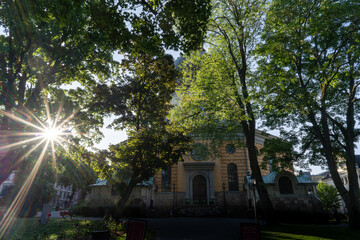 Fototapeta premium The Hedvig Eleonora F�rsamling church through the trees in Stockholm, Sweden.