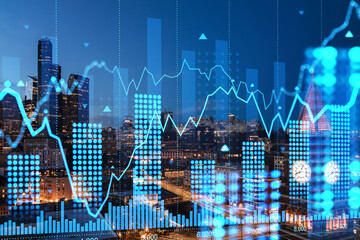 Digital financial chart over cityscape of Seattle at night.