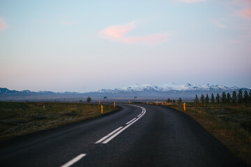 Scenic highway with mountain in the background in Iceland
