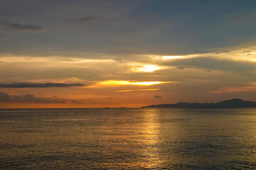 Sky is a beautiful orange color as the sun sets