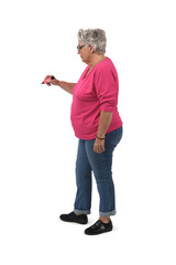 side view of senior woman drawing with marker on white background