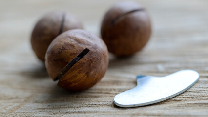 macadamia nuts on wooden background