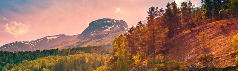 Beautiful mountain landscape with cloudy sunset sky. Nature of Norway