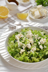 Classic Greek green lettuce salad with feta cheese