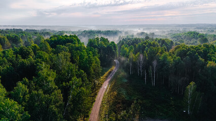 The car is driving along the road