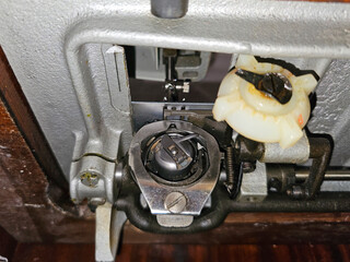 Shuttle from a sewing machine. Internal mechanism of a sewing machine. Old sewing machine.

