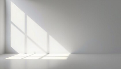 Sunlight streaming through window in empty white room.