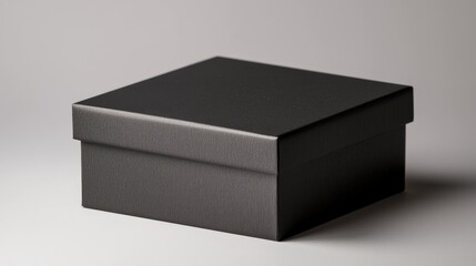 Naklejka premium A sleek black box with a textured surface, elegantly designed, ideal for storage or gift presentation.