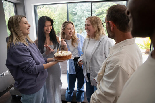 Friends celebrating birthday at home