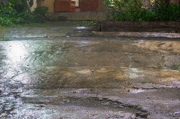 view of wet ground after rain at night