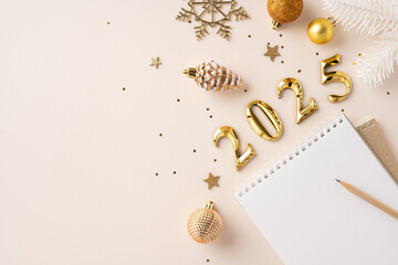 Top view of elegant 2025 concept with gold ornaments, notebook, and pencil symbolizing new year celebrations and resolutions