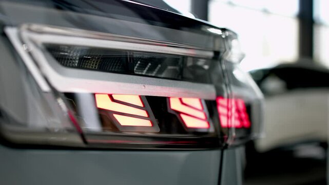 Close-up of advanced car headlight technology in a modern car interior. The sleek design illuminates the road, showcasing innovation and enhancing nighttime visibility.