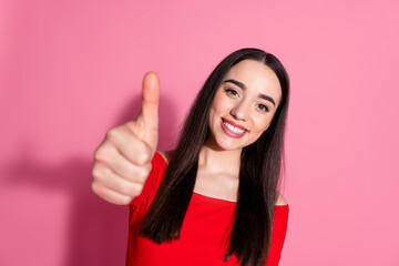 Photo of nice young girl show thumb up red top isolated on pink color background