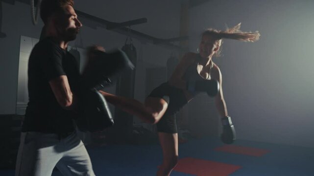Intense kickboxing training session at local gym focusing on striking techniques and footwork drills