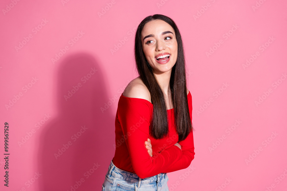 Wall mural Photo of gorgeous young woman folded arms look empty space laugh red shirt isolated on pink color background