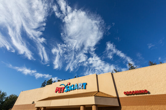 Beaverton, OR, USA - September 28, 2024 - Famous pets store chain Petsmart signage on on its store building captured at sunny fall day with beautiful blue sky. high quality picture for download	
