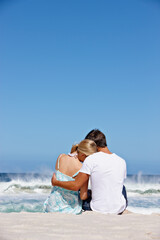 Back view, space or couple hug at sea with love to relax on vacation, valentines day or holiday. Blue sky, mockup or people at ocean for bonding together at beach on romantic trip on island in Greece