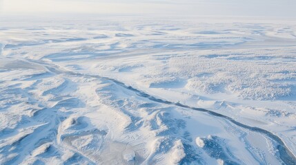 Winter Wonderland: A Frozen River Meanders Through a Snow-Covered Landscape