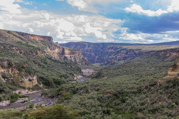 Naklejka premium Hell's Gate National Park is a national park situated near Lake Naivasha in Kenya. The park is named after a narrow break in the cliffs, once a tributary of a prehistoric lake that fed early humans in