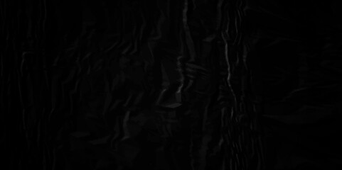 Black crumpled paper texture . Black wrinkled paper texture. Black paper texture . Black crumpled and top view textures can be used for background of text or any contents .