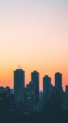 Fototapeta premium Minimalist Urban Silhouettes Against Sunset Gradient