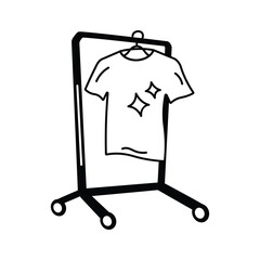 A standing clothes rack holding a clean shirt for drying