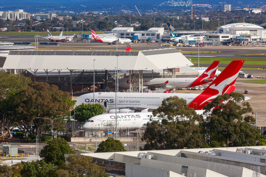 Qantas passenger and cargo planes parked at Sydney International Airport, Australia. June 3, 2024
