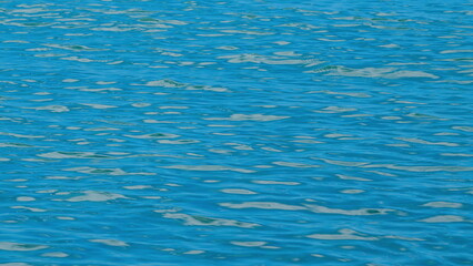 Obraz premium Blue Glittering Sea Surface. Crystal Clear Sea Water.