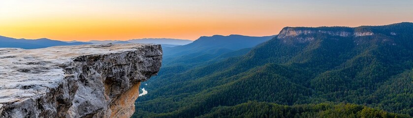 Obraz premium Dramatic mountain cliffs bathed in golden sunset light