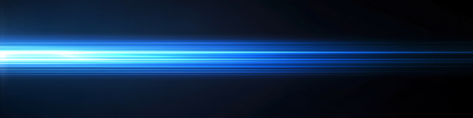 Blue light streaks on a black background with glowing horizontal lines in a high speed motion blur effect. 
