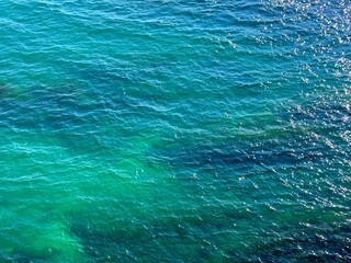 Blue turquoise sea water shiny background