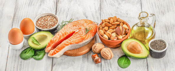 Food sources of omega 3 and healthy fats on a wooden background. top view