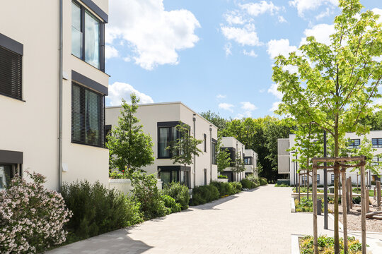 Residential area with ecological and sustainable green residential buildings, low-energy houses with apartments and green courtyard