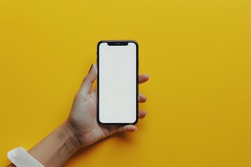 Female hand holding smartphone with blank screen on yellow background, mockup