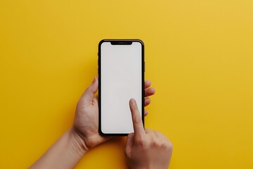Female hand holding smartphone with blank screen on yellow background, mockup