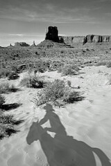 Simulated vintage image of the shadow of a cowboy in Monument Valley, Arizona, USA 