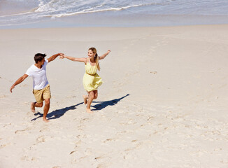 Beach, holding hands and couple with love, travel and romance with vacation, relationship and...