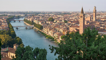 A panoramic view of Verona with Adige River and the old town, as seen from the observation point Punto Panoramico near San Pietro castle. Verona at the sunrise.