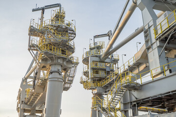 Industrial Crane Structure. A close up view of an industrial crane structure, showing the intricate details and robust