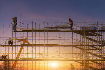 Scaffolding pipe clamp and parts,construction site with scaffold and building strength to scaffold clamps in used on construction site with sunset background,scaffolding for construction factory