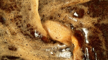Macro Shot of Foam Mixing with Coffee Drink in Detail.