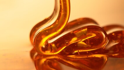 Organic Real Honey Pouring in Extreme Macro Shot. Selective Focus.