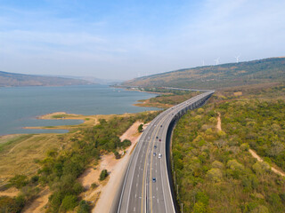 The M6  motorway Expressway Nakhon Ratchasima Province - Bang Pa-in. Lam Ta Khong River and Mountain. Drone shot of scenic landscape rural place traffic. Nakhon Ratchasima Thailand. Motorway Korat