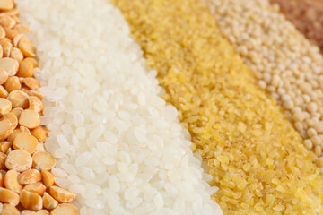 Different cereal grains as background, closeup view