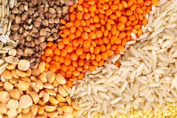 Different cereal grains as background, top view