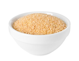 Raw wheat groats in bowl isolated on white