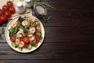 Delicious shrimp salad and ingredients on wooden table, top view. Space for text