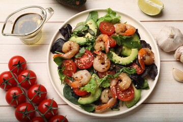 Delicious shrimp salad and ingredients on white wooden table, flat lay
